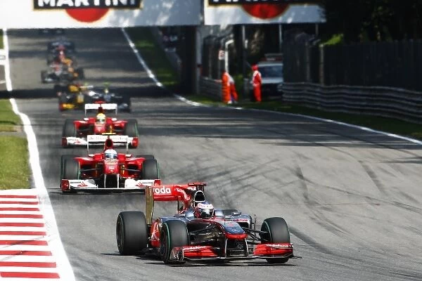 Formula One World Championship: Jenson Button McLaren MP4  /  25 leads on the opening lap of the race