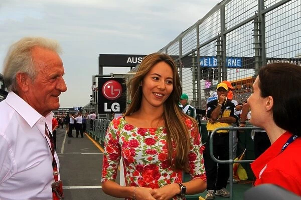 Formula One World Championship: Jessica Michibata with John Button on the grid