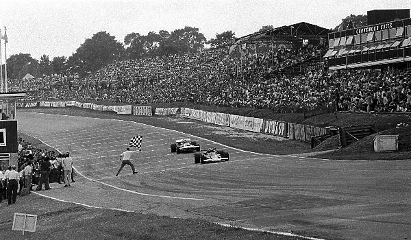 Formula One World Championship: Jochen Rindt takes the flag in his Lotus 72C to win his 3rd Grand Prix in a row