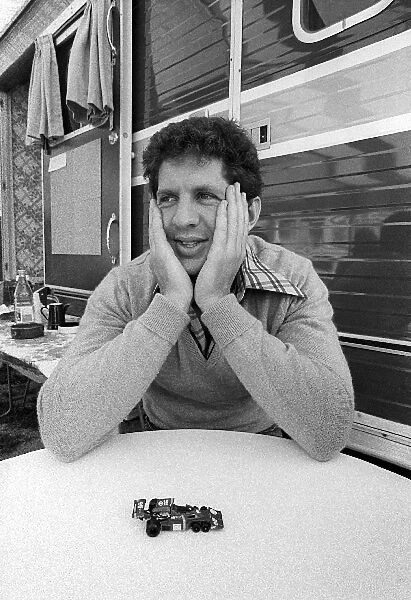Formula One World Championship: Jody Scheckter amuses himself with a model of the six wheeled Tyrrell P34