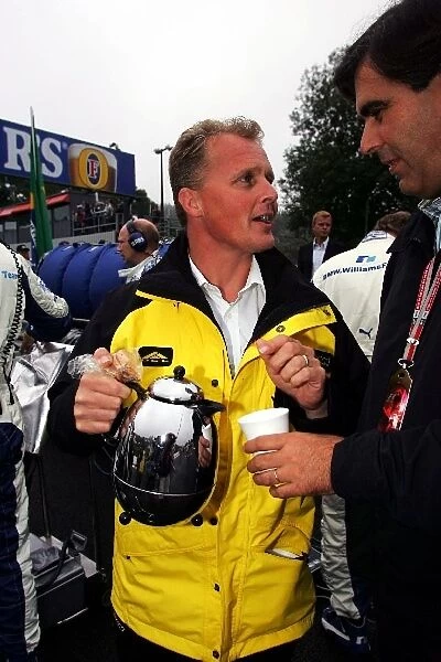 Formula One World Championship: Johnny Herbert Jordan Sporting Relations Manager on the grid with a pot of tea