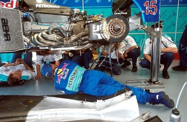 Formula One World Championship: Johnny Herbert Sauber Petronas C17 looks underneath his race car