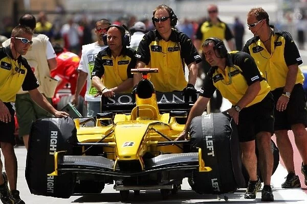 Formula One World Championship: Jordan mechanics push back the Jordan EJ15 of Tiago Monteiro Jordan