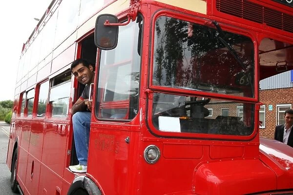 Formula One World Championship: Karun Chandhok Hispania Racing F1 Team at the wheel of a Routemaster bus at the Cosworth Factory in Northampton