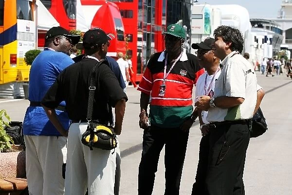 Formula One World Championship: Kenyans in the paddock with Pasquale Lattuneddu of the FOM