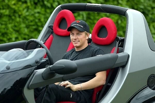 Formula One World Championship: Kimi Raikkonen drives an open top Smart car