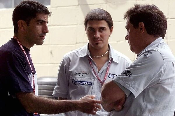 Formula One World Championship: L-R: Marc Gene, Minardi team member, Giancarlo Minardi Minardi team Manager