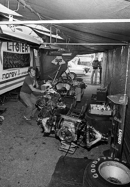 Formula One World Championship: A Ligier mechanic prepares a Ligier JS7 with its Matra V12 engine in the paddock