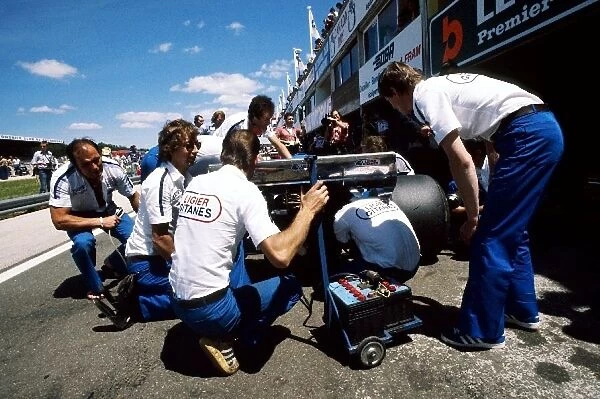 Formula One World Championship: The Ligier mechanics work on the rear of Jacques Laffites JS7 during practice