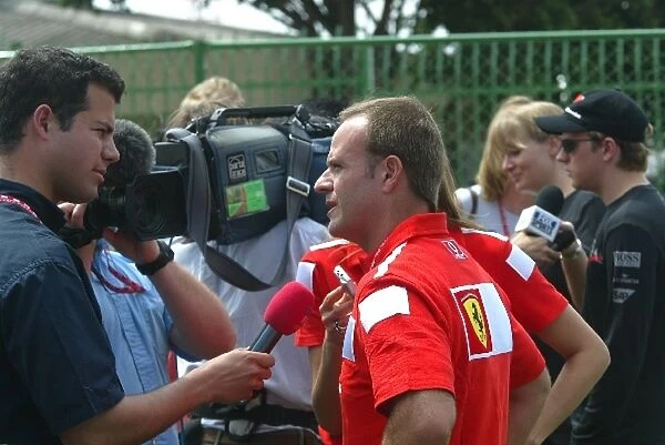 Formula One World Championship: Local hero Rubens Barrichello Ferrari is interviewed by Ted Kravitz ITV Pit-Lane Reporter