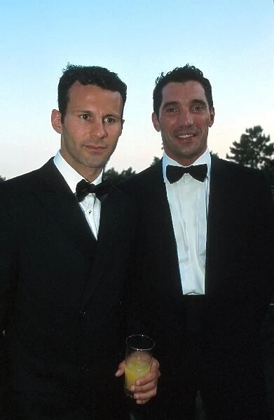 Formula One World Championship: Manchester United footballer Ryan Giggs with Max Papis, right