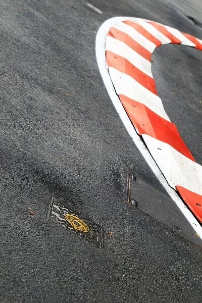 Formula One World Championship: Manhole cover next to a kerb