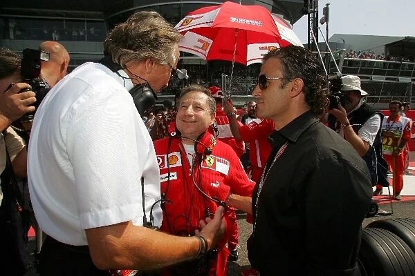 Formula One World Championship: Mansour Ojjeh talks with Jean Alesi and Jean Todt Ferrari Sporting Director on the grid