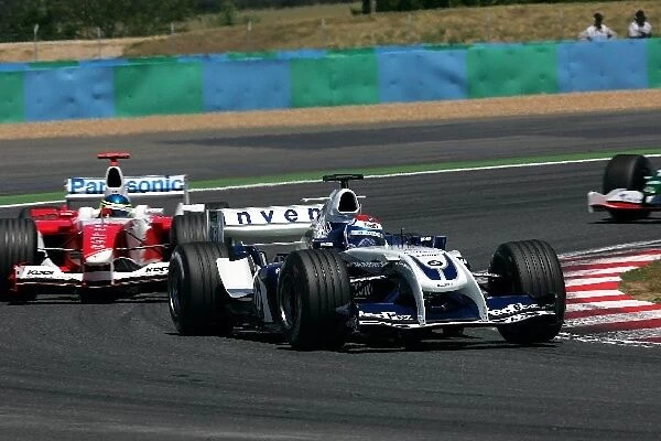 Formula One World Championship: Marc Gene Williams BMW FW26 leads Cristiano Da Matta Toyota TF104