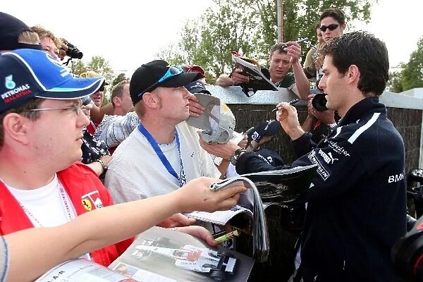 Formula One World Championship: Mark Webber Williams signs autographs for fans