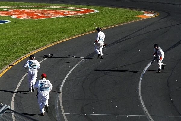 Formula One World Championship: Marshals clear the track