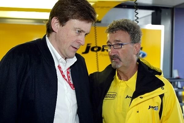 Formula One World Championship: Martin Whitaker of Ford chats with Eddie Jordan Jordan Team Principal