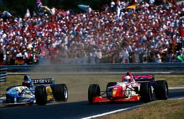 Formula One World Championship: Max Papis, Arrows Hart FA16, is lapped by Michael Schumacher, Benetton Renault B195