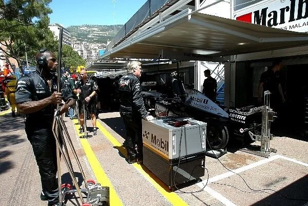Formula One World Championship: The McLaren team were working on their cars behind screens despite being told not to by the FIA