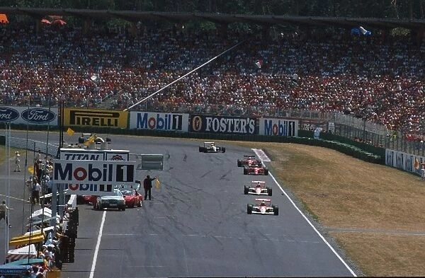 Formula One World Championship: The McLarens of Ayrton Senna and Gerhard Berger pass the accident of Emanuelle Pirros Dallara