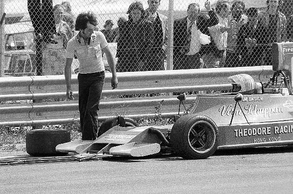Formula One World Championship: A mechanic comes to replace the punctured front right tyre of the Ensign Theodore N174 of Vern Schuppan at the