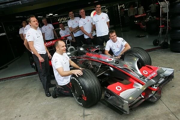 Formula One World Championship: Mechanics of Lewis Hamilton McLaren Mercedes MP4 / 23 team photograph