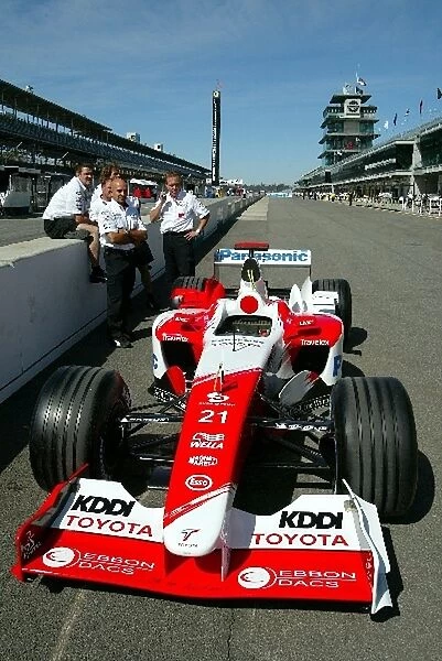 Formula One World Championship: Mechanics and a Toyota TF103 in the Indianapolis pitlane