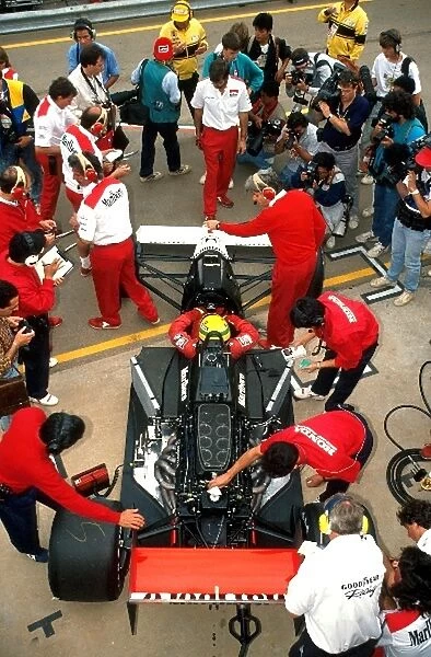 Formula One World Championship: Mechanics work on Ayrton Sennas McLaren MP4  /  5