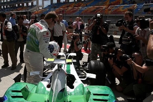 Formula One World Championship: Media surround Rubens Barrichello Honda Racing F1 Team as he celebrates 257 GPs
