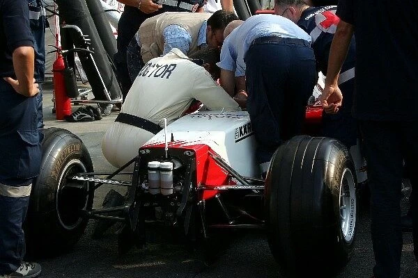 Formula One World Championship: The medical team practice driver extraction using a Toyota TF104B chassis in the pitlane