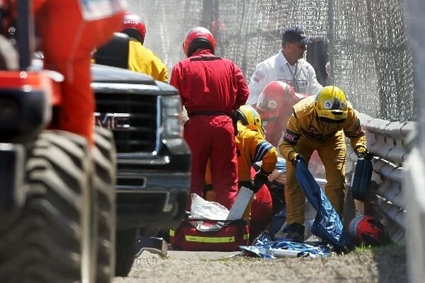 Formula One World Championship: The medics attend to Robert Kubica BMW Sauber F1. 07 after he crashes