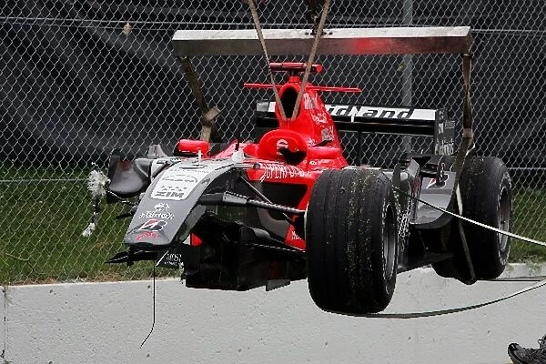 Formula One World Championship: The MF1 M16 of Tiago Monteiro MF1 Racing after crashing at the final corner