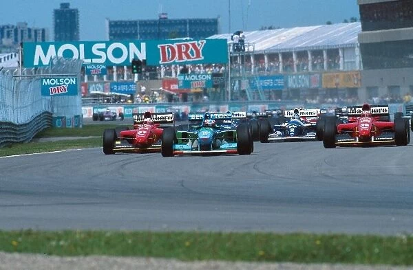 Formula One World Championship: Michael Schumacher Benetton B194 leads at the start of the race
