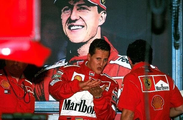 Formula One World Championship: Michael Schumacher Ferrari F1 2000, 2nd place in deep discussion with Ferrari engineers