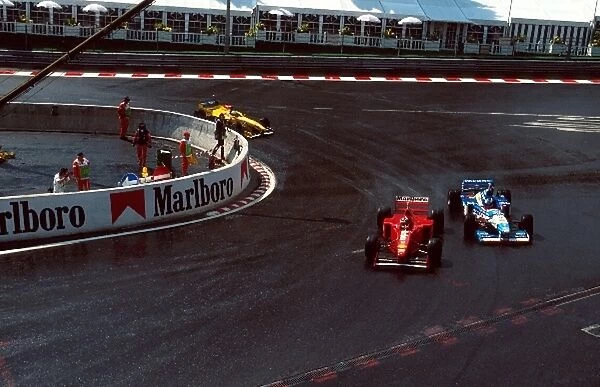 Formula One World Championship: Michael Schumacher Ferrari F310B overtakes Jean Alesi Benetton