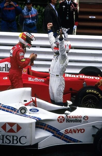 Formula One World Championship: Michael Schumacher, Ferrari F310B 1st place with Rubens Barrichello, Stewart SF-1 2nd place in Parc-Ferme