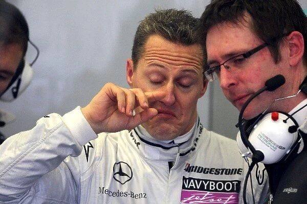 Formula One World Championship: Michael Schumacher Mercedes GP talks with Andy Shovlin Mercedes Race Engineer
