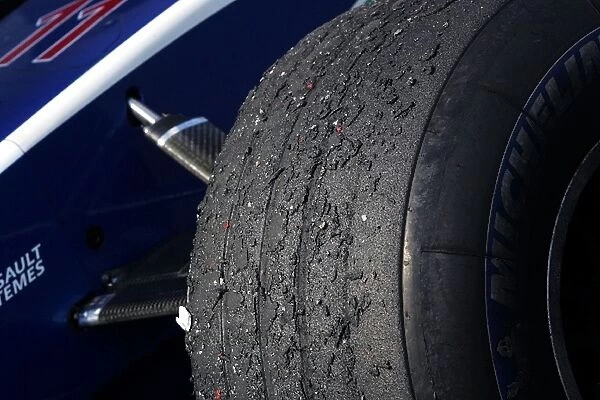 Formula One World Championship: Michelin tyre showing wear in parc ferme