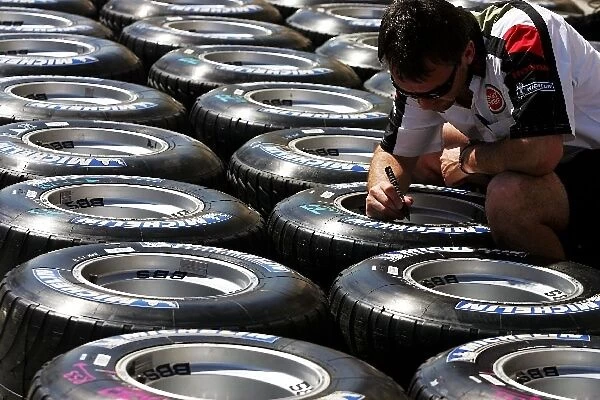 Formula One World Championship: Michelin tyres marked by a Honda mechanic