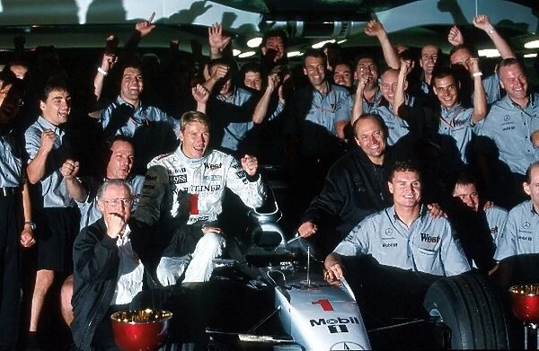 Formula One World Championship: Mika Hakkinen, David Coulthard and the Mclaren team celebrate their victory