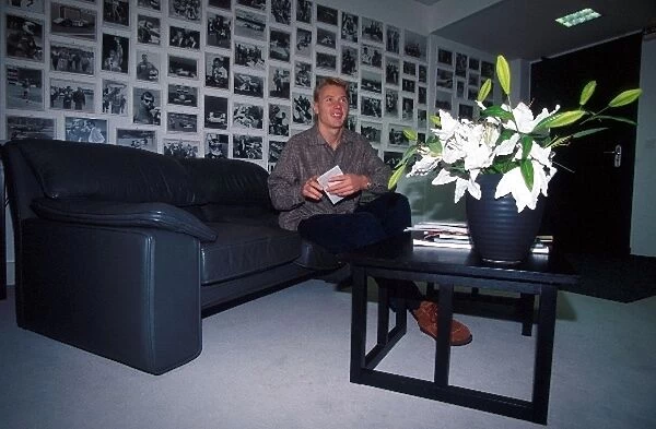 Formula One World Championship: Mika Hakkinen with pictures of his achievements on his wall
