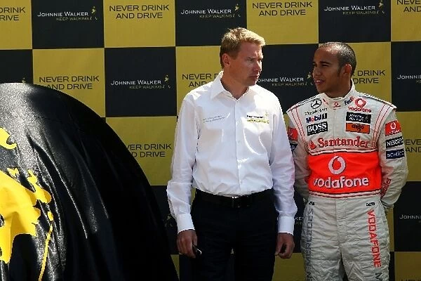 Formula One World Championship: Mika Hakkinen with Lewis Hamilton McLaren at the Johnnie Walker Drink Responsibly Campaign