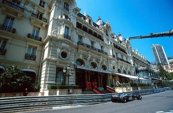Formula One World Championship: Mika Hakkinen Mclaren MP4-15, 6th place passes the Hotel de Paris in Casino Square
