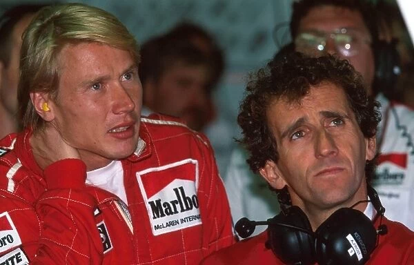 Formula One World Championship: Mika Hakkinen Mclaren MP4-11 and Alain Prost, right