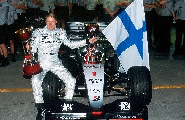 Formula One World Championship: Mika Hakkinen Mclaren MP4-14 race winner and World Champion for the second year running