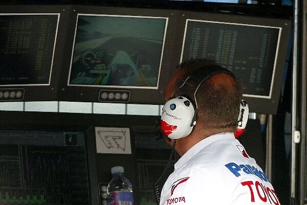 Formula One World Championship: Mike Gascoyne Toyota Technical Director watches the timing screens