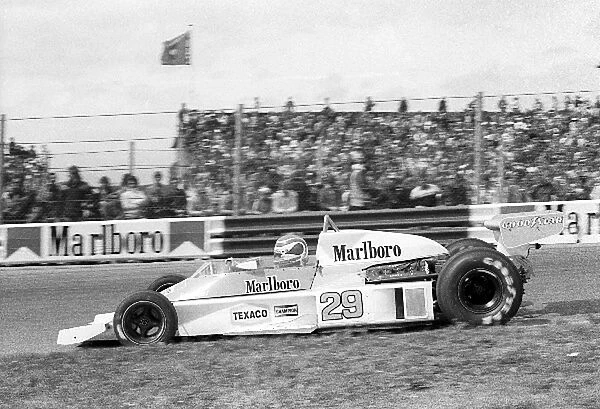 Formula One World Championship: Nelson Piquet McLaren M23 retired from the race on lap 17 with a broken driveshaft