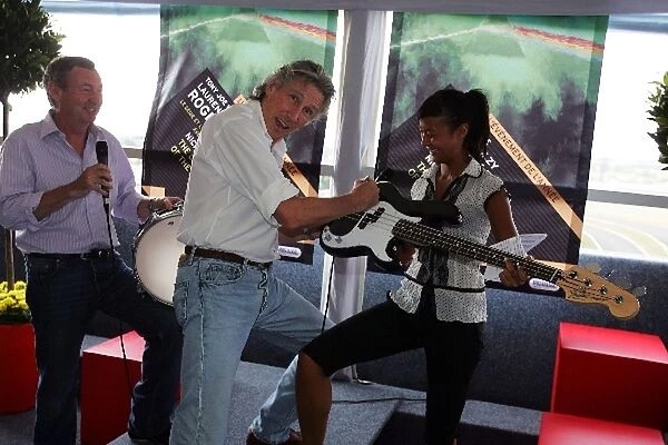 Formula One World Championship: Nick Mason Pink Floyd Drummer and Roger Waters Pink Floyd Guitarist sign their instruments at a pre concert drinks
