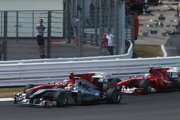 Formula One World Championship: Nico Rosberg Mercedes GP MGP W01 and Fernando Alonso Ferrari F10 at the start of the race