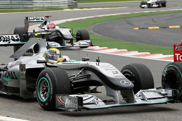 Formula One World Championship: Nico Rosberg Mercedes GP MGP W01 runs wide battling with Vitaly Petrov Renault R30